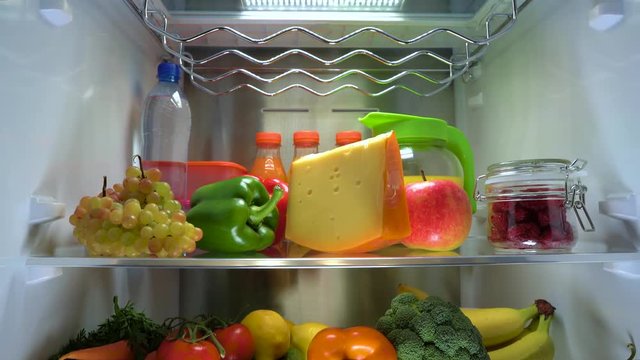 Products in the refrigerator. Piece of cheese in the refrigerator