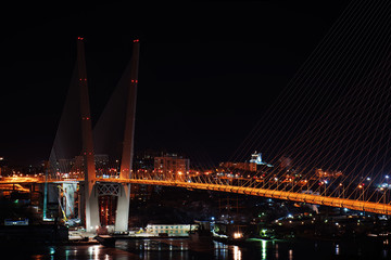 night view of the bridge in the Russian Vladivostok over the Golden Horn bay