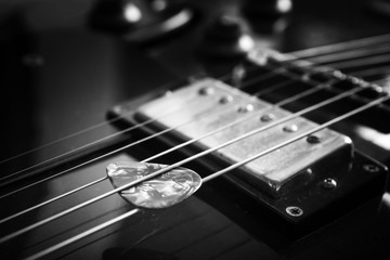 Fototapeta na wymiar Acoustic guitar close up in dark background