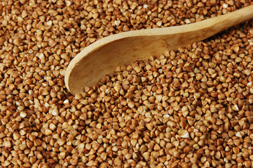 buckwheat groats and wooden spoon