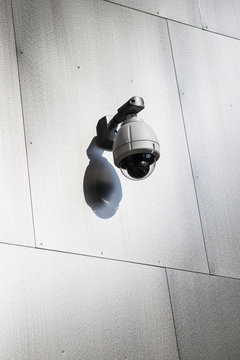 Close-up of security camera mounted on wall