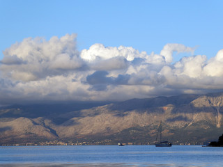 A yacht at near the island of Cheloni, Lefkada (Lefkas), Greece with the Greek mainland in the background
