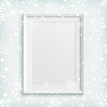 White picture frame on winter background.