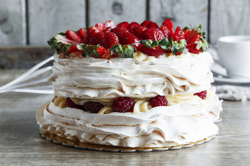 meringue cake with custard and strawberry raspberry