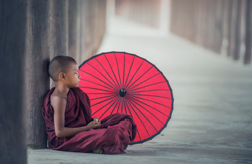Little Myanmar monk sitting in monastery, Bagan, Myanmar