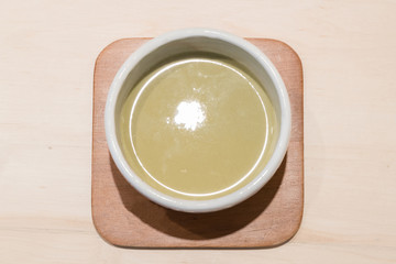 Organic green matcha tea in a bowl
