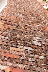 Close up of old red tile roofs