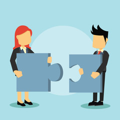 business man and business woman holding puzzle block