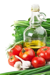 vegetables and a bottle of oil, still life
