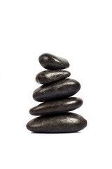 Fototapeta na wymiar stack of five black stones on a white background