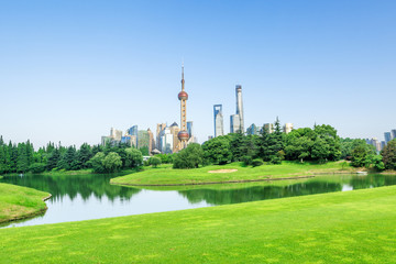 Shanghai skyscrapers and green city park, China