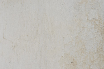 Wall fragment with scratches and cracks