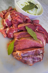 Cutting raw meat