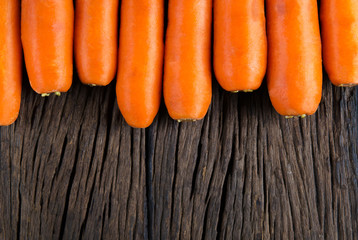 Carrot on wood background