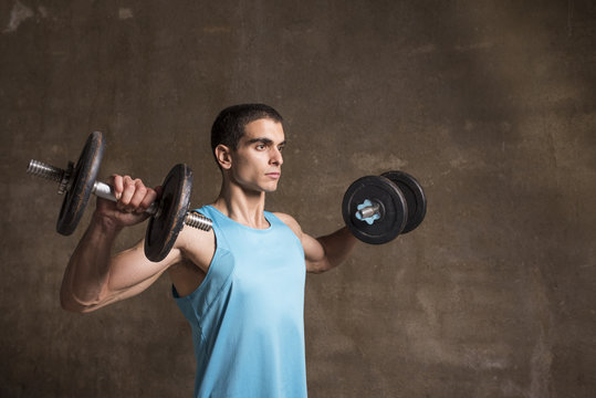 Young Man Lifting Weights