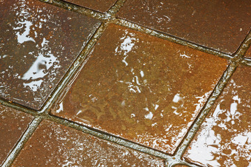 Textures and Colorful Brown and Golden Reflections on Tiles