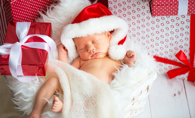 sleeper newborn baby in  Christmas Santa cap