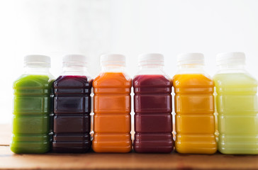 bottles with different fruit or vegetable juices