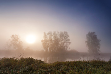 Fototapeta na wymiar Autumn misty sunrise on the river