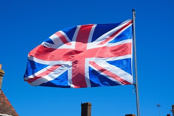 Union Jack flag against a blue sky.