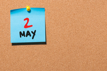 May 2nd. Day 2 of month, calendar on cork notice board, business background. Spring time, empty space for text