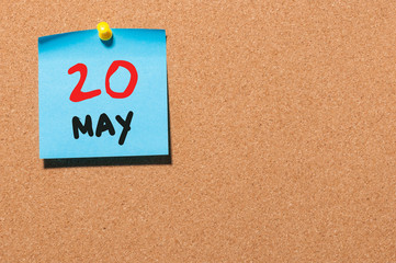 May 20th. Day 20 of month, calendar on cork notice board, business background. Spring time, empty space for text