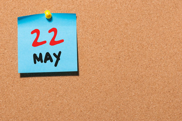 May 22nd. Day 22 of month, calendar on cork notice board, business background. Spring time, empty...