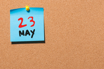 May 23rd. Day 23 of month, calendar on cork notice board, business background. Spring time, empty space for text