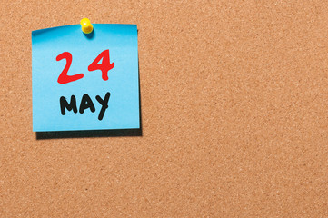 May 24th. Day 24 of month, calendar on cork notice board, business background. Spring time, empty space for text