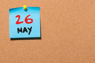 May 26th. Day 26 of month, calendar on cork notice board, business background. Spring time, empty space for text