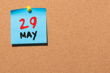 May 29th. Day 29 of month, calendar on cork notice board, business background. Spring time, empty space for text