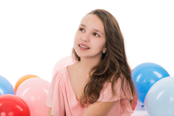 teenager girl with balloons isolated on white background