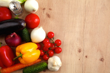Composition with assorted raw organic vegetables wooden table