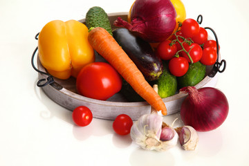 Composition with assorted raw organic vegetables wooden table