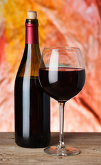 bottle and glass of red wine