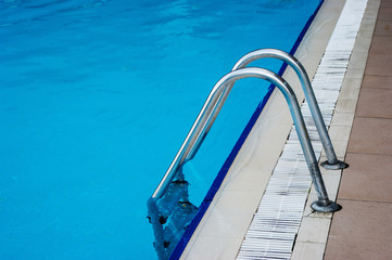 Obraz premium blue swimming pool with steel ladder