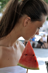 Beautiful girl enjoying life with watermelon
