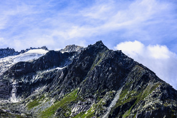 Fototapeta na wymiar dramatic picture with mountain peak in alps