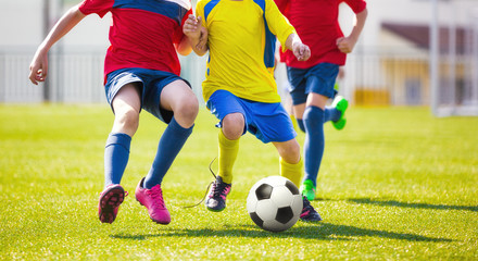 Children play football. Soccer football game for youth. School soccer tourmanet for kids