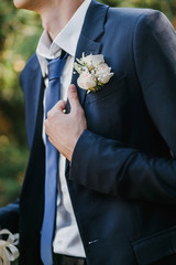 groom in suit, hand close-up