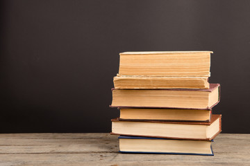 School books on desk, education concept