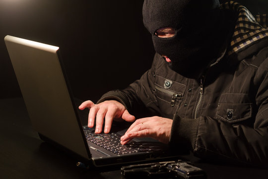 Dangerous cyber criminal trying to crack password protected notebook