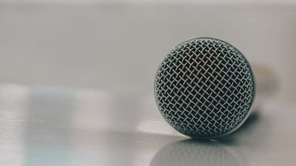 Close-up of microphone on table.