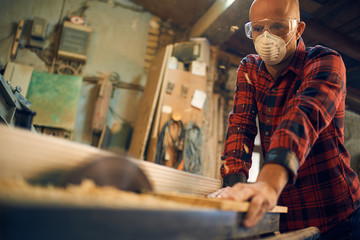 Carpenter at work at his workshop