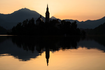 Fototapeta na wymiar Lake Bled and island silhouette at dawn in Slovenia