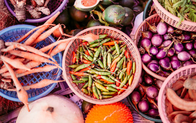 Thai exotic food in street food market with vegetable and fruit. Like the charming people, exotic foods greets you on almost every corner in Thailand. with vintage filter