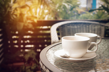 Obraz premium hot coffee espresso and tea with nature background in garden. with vintage filter