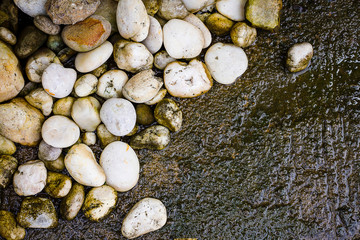 River gravel laid on the cement floor.