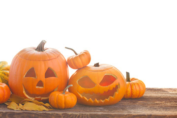 orange halloween pumpkins on wooden table over white background border