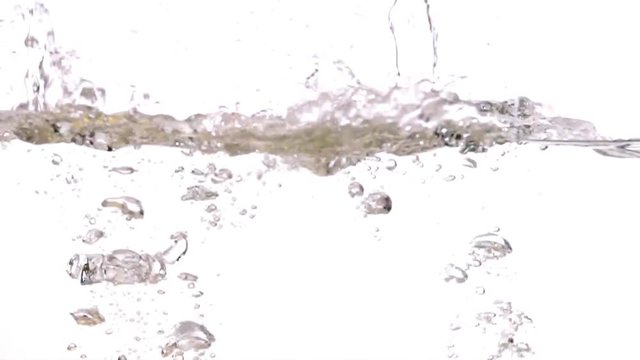 Lemon and lime falling into water on white background slow motion HD video. Water surface with floating whole citrus fruits, splash bubbles and waves.
